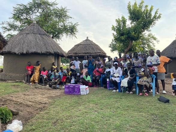 Community gathering during a field report visit